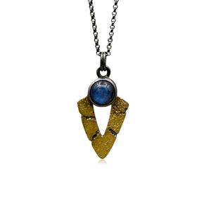 Necklace with a gold and black pendant on a white background