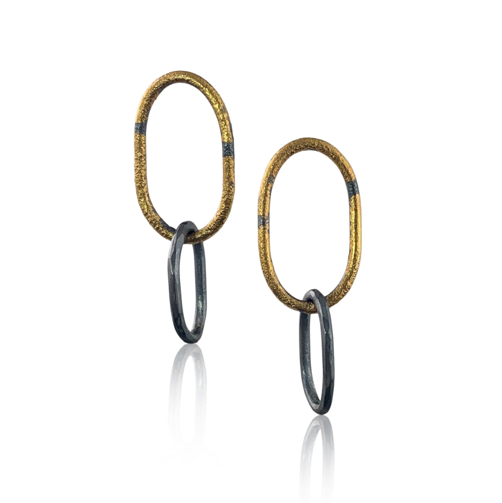 A pair of oxidized silver and 23K gold colored Pompeii link earrings with interlocking chain design.